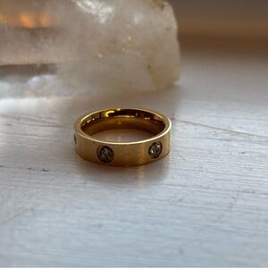 Gold Tome Rhinestone Love Ring. Size 5, 6, 7